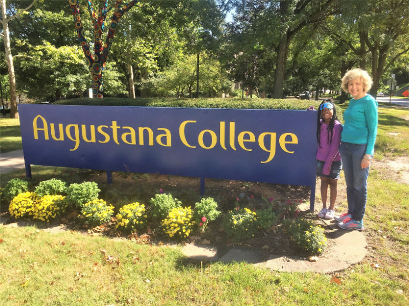 Augustana Collage Sign with Heidi and Child