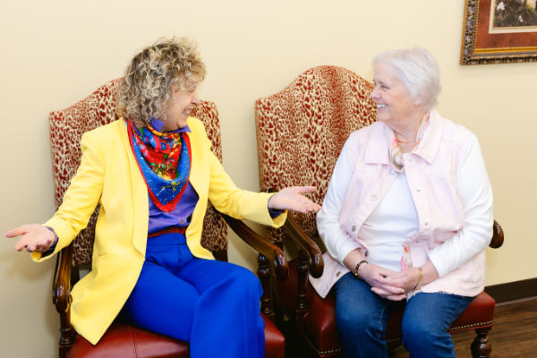 two women talking in Huiskamp Collins